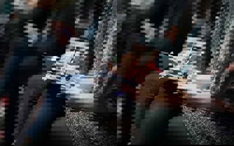 A person making notes at an event