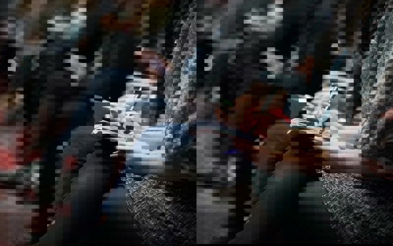 A person making notes at an event