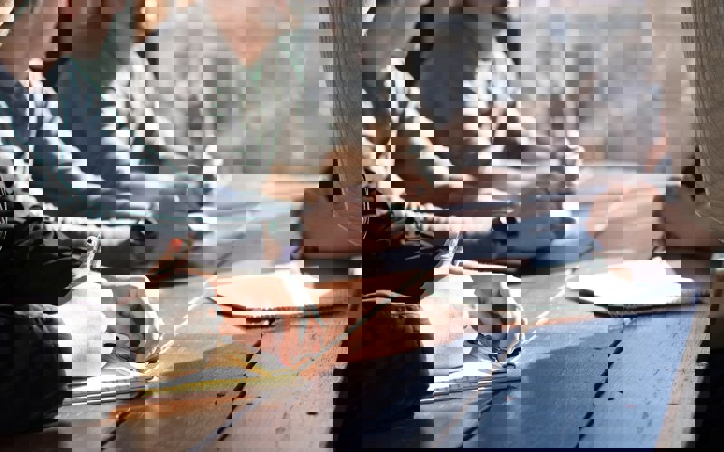 A group of people sitting around a table